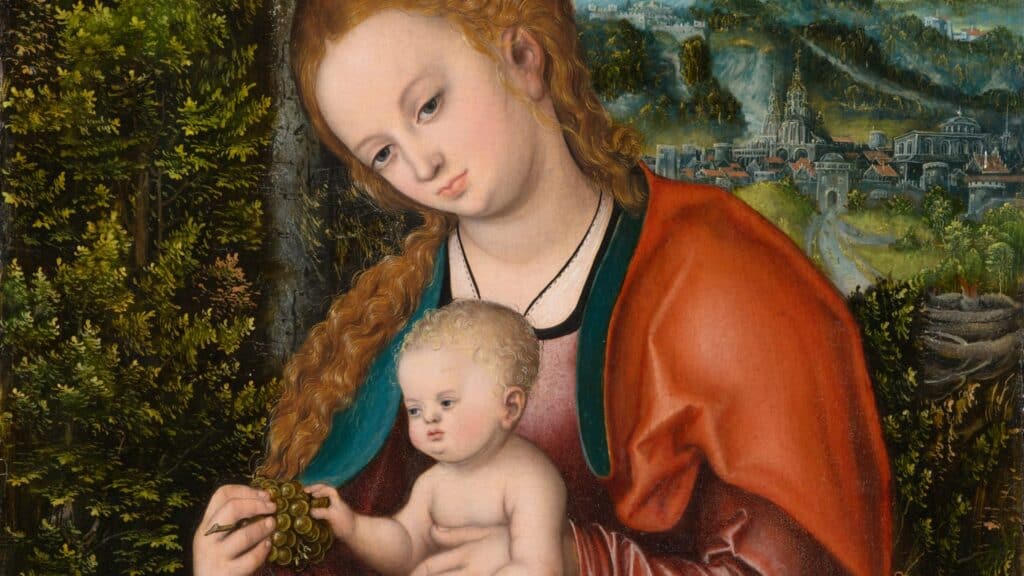 An oil painting of a light-skinned woman wearing biblical-era clothing and holding a naked, blonde light-skinned child on a black pillow. In the background there are trees and city nestled underneath a mountain. 