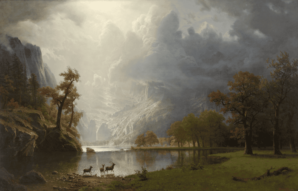 A landscape painting of trees surrounding a lake with sunlit mountains covered in clouds in the distance