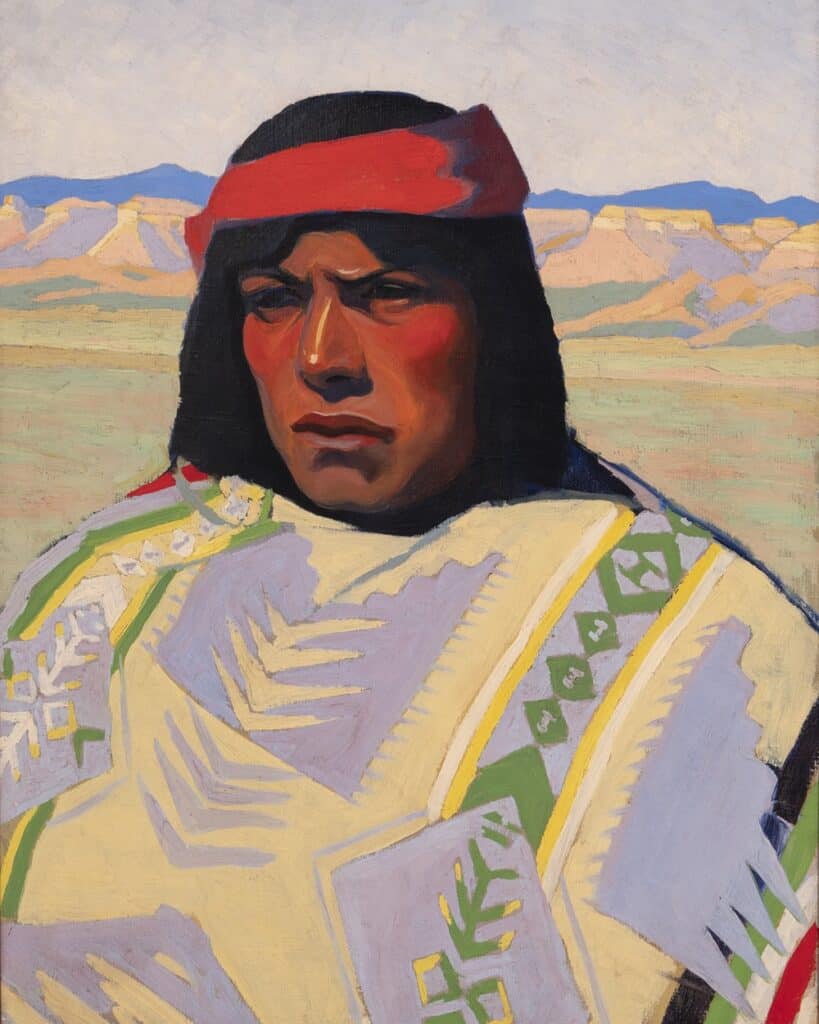 A painted, bust-length portrait of an American Indian wrapped in a patterned blanket within a landscape of colorful buttes.