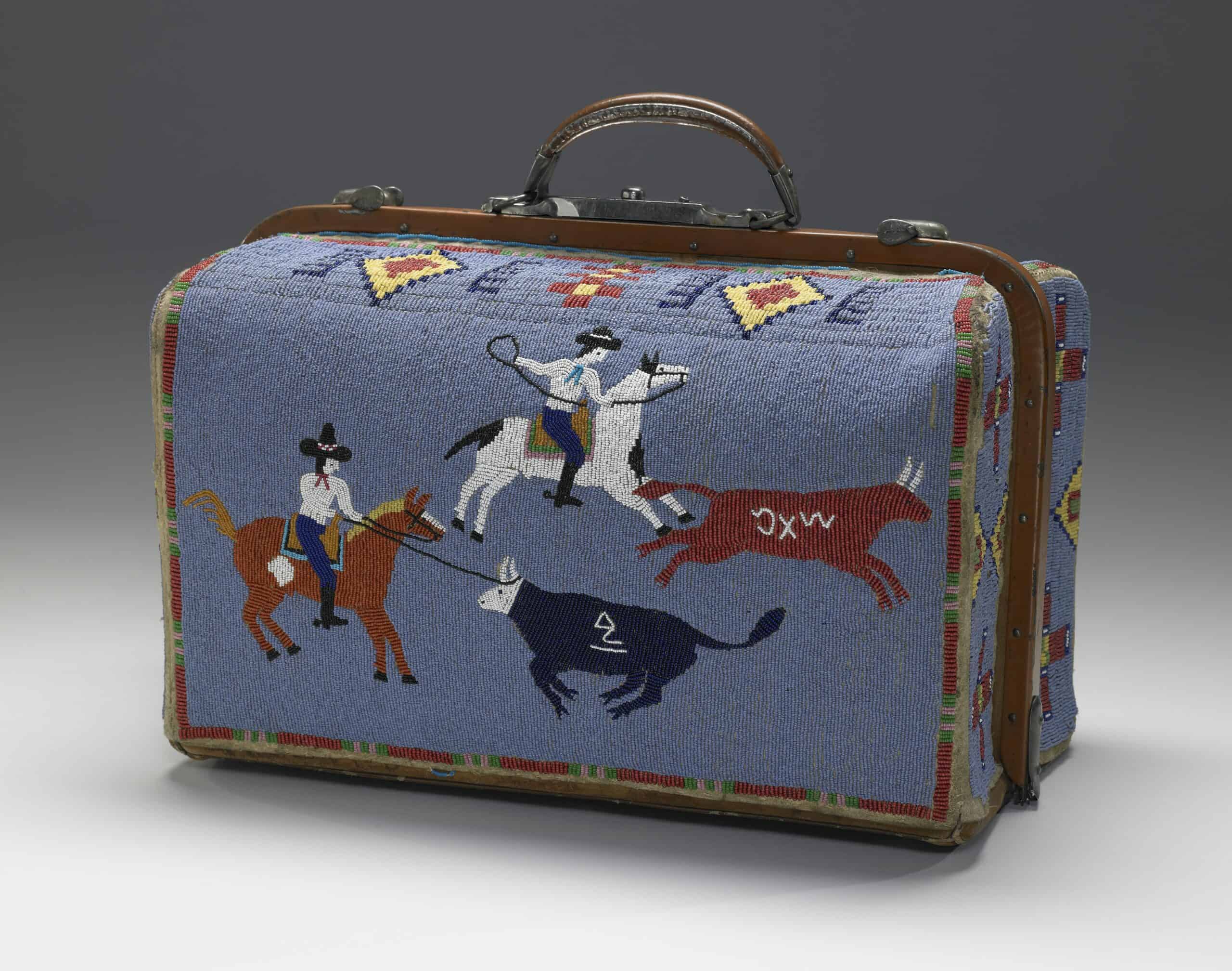 A beaded suitcase decorated with a scene of four figures with eleven horses, a tepee, and wedding gifts.