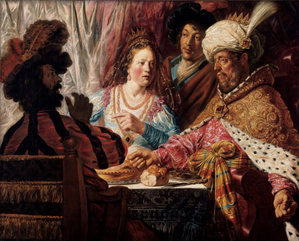 Four figures in vibrant, patterned clothing seated at a table, engaged in expressive conversation.