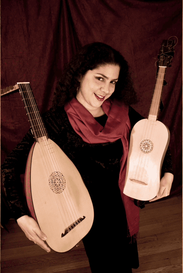 A standing woman in a black dress and red scarf holds stringed instruments in each arm.