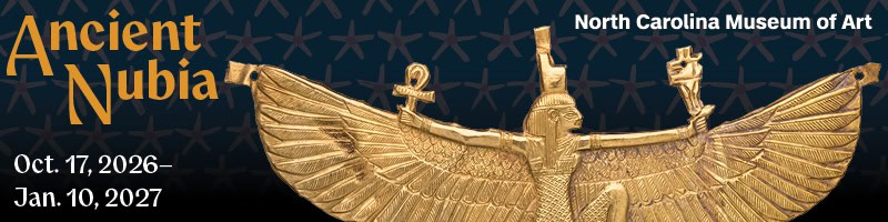 Banner image promoting Ancient Nubia exhibition with a golden winged woman pendant.